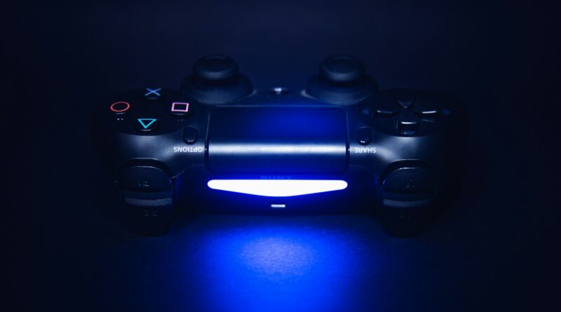 A video game controller lit up alone in the dark, representing a game cancelled by the AI slop backlash