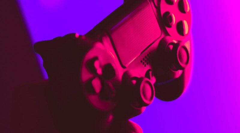 A black and gray video game controller resting on a dark surface, symbolizing the Call of Duty Modern Warfare 4 AI art controversy