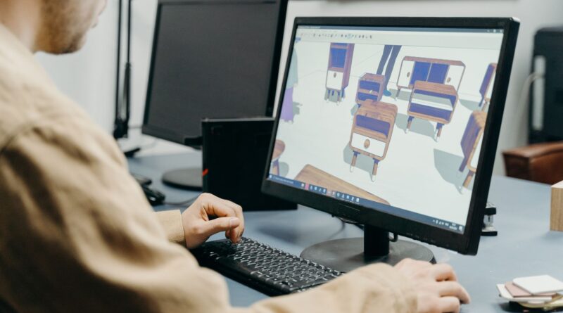 Artist inspecting a 3D model on a monitor for a guide to AI 3D model generators